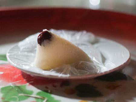 Tangaza - sticky rice wrapped in banana leaves and served with syrup