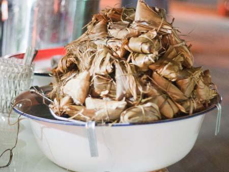 Tangaza - sticky rice wrapped in banana leaves and served with syrup