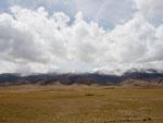 Snow capped mountains, against a clear blue sky