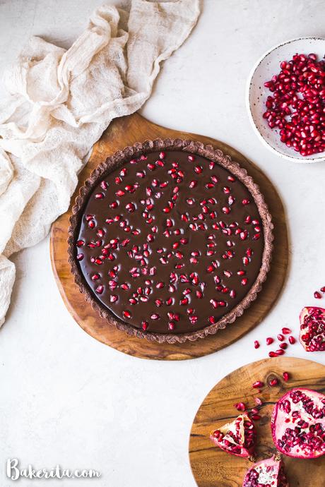 This No-Bake Chocolate Pomegranate Tart is made with 8 simple ingredients and is perfect for holiday entertaining! No baking required for this gluten-free, paleo, and vegan tart.