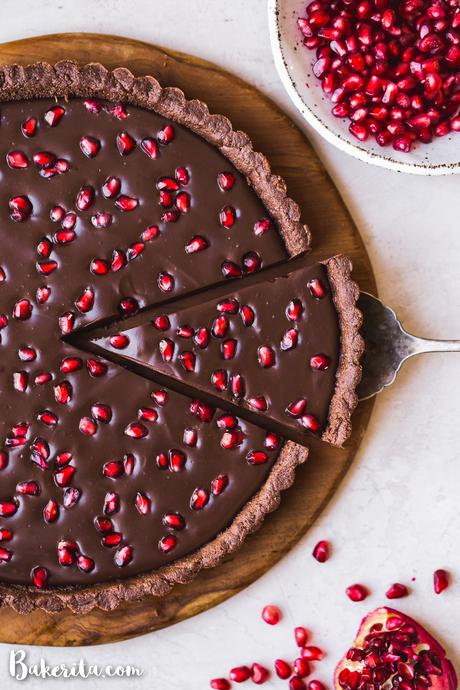 This No-Bake Chocolate Pomegranate Tart is made with 8 simple ingredients and is perfect for holiday entertaining! No baking required for this gluten-free, paleo, and vegan tart.
