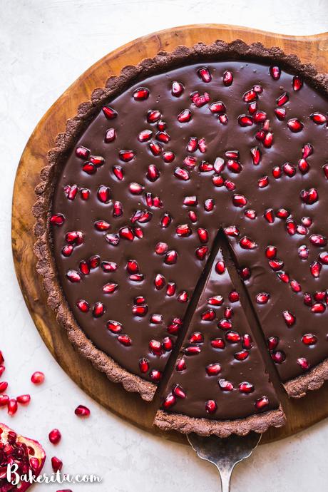 This No-Bake Chocolate Pomegranate Tart is made with 8 simple ingredients and is perfect for holiday entertaining! No baking required for this gluten-free, paleo, and vegan tart.