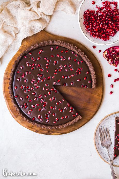 This No-Bake Chocolate Pomegranate Tart is made with 8 simple ingredients and is perfect for holiday entertaining! No baking required for this gluten-free, paleo, and vegan tart.