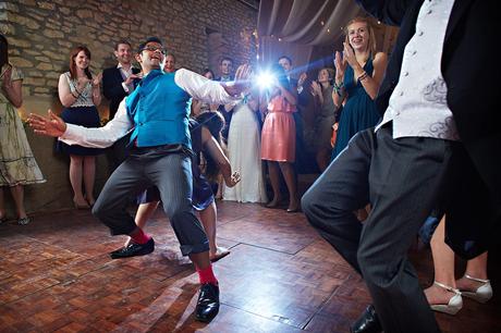 100 Best Barn Wedding Photos the groom dances with his guests