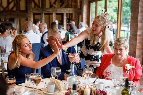 100 Best Barn Wedding Photos guests high five each other