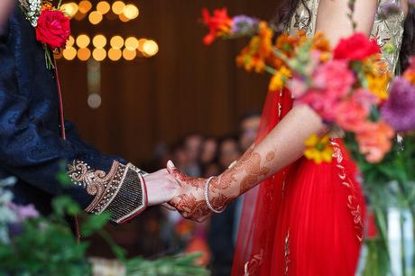 100 Best Barn Wedding Photos holding hands at a sussex barn wedding ceremony