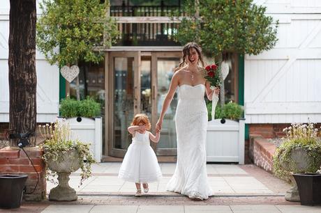 100 Best Barn Wedding Photos a bride walks with her flowergirl