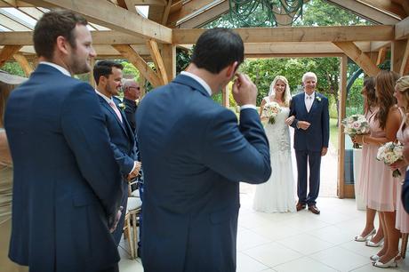 100 Best Barn Wedding Photos the groom sheds a tear as his bride arrives