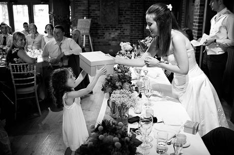 100 Best Barn Wedding Photos the bride gives a flowergirl a gift