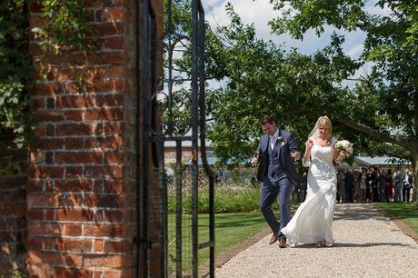 100 Best Barn Wedding Photos bride and groom walk through gaynes park