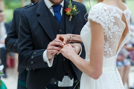 exchanging rings at a gaynes park wedding