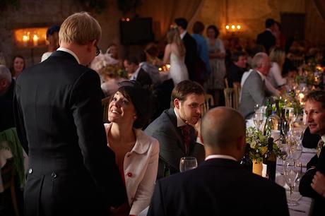 100 Best Barn Wedding Photos guests chat during a barn wedding