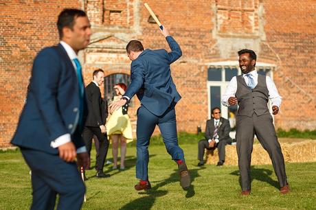 100 Best Barn Wedding Photos guests play rounders outside the wedding barn