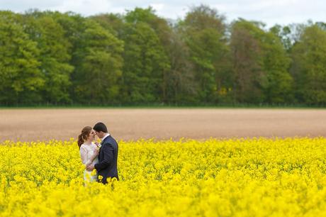 bride and groom in the fields at cripps stone barn