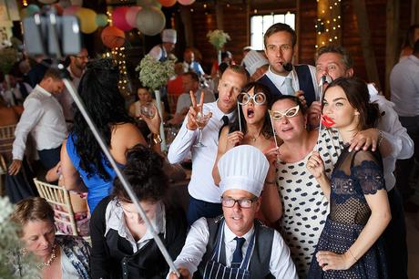 100 Best Barn Wedding Photos the groom poses for a selfie with guests
