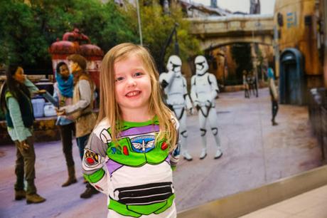 A child prepares to board a shuttle to the Main Terminal at Orlando International Airport, Nov. 16, 2019, in Orlando Fla. Disney installed artistic renderings on the terminal shuttle stations to bring the adventure of Star Wars: Galaxy’s Edge at Disney’s Hollywood Studios to airport travelers.