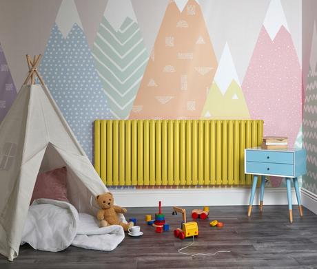 Yellow Milano Aruba designer radiator in a playroom