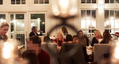 Woman discovers her husband is cheating after seeing him with a lady in the background of a newspaper review