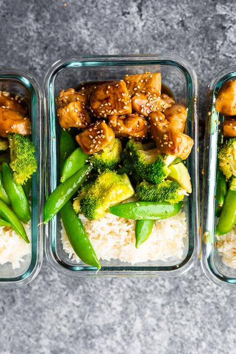 overhead shot of Honey Sesame Chicken Lunch Bowls in meal prep container