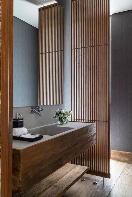 natural wood and concrete single sink floating vanity in bathroom wood slats