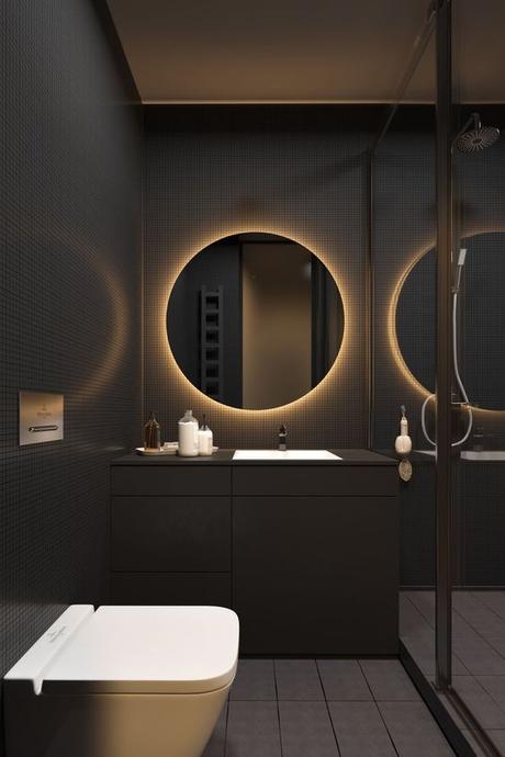 matte black modern single vanity in bathroom with black tile walls and wall mounted toilet