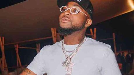Davido Unveils Son’s Face On Diamond Necklace (Photo)