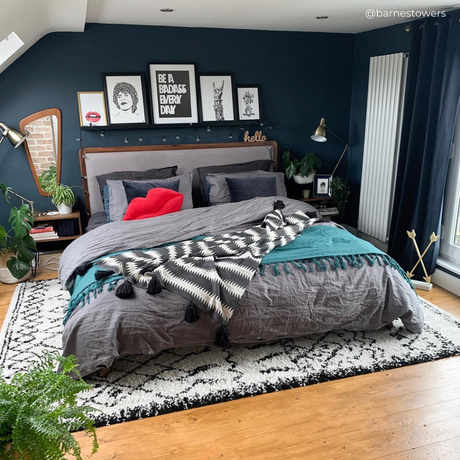 white vertical radiator in a blue bedroom