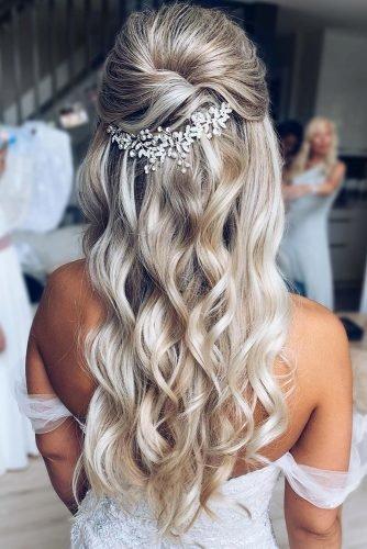 wedding hair trends elegant swept half up half hairdown with elegant crystal accessories caitlynmeyermua