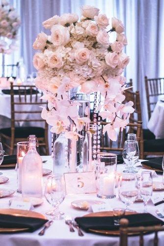 average cost of wedding venues roses centerpiece on top of table