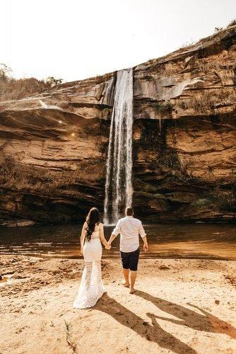 wedding venue ideas bride and groom near waterfall