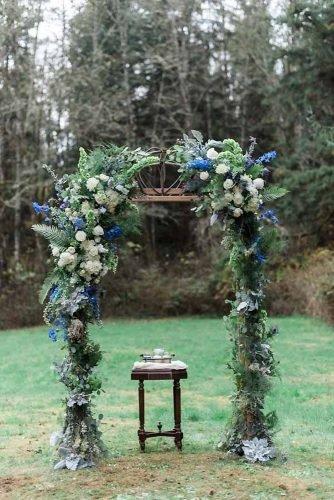 classic blue wedding elegant bridal altar with greenery hope helmuth photography