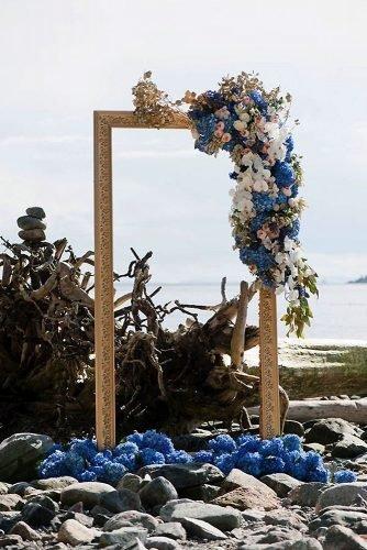 classic blue wedding elegant bridal artar on the beach gold frame with flowers jasalyn thorne photographers