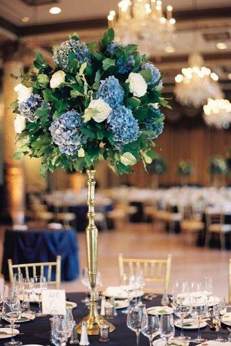 classic blue wedding simple flower centerpiece in tall gold stand kristin la voie photography