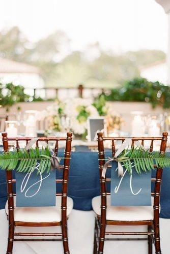 classic blue wedding blue signs and greenery on chairs decor ktmerry