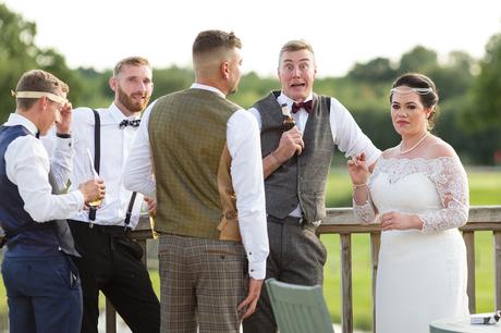 Guest makes funny face for the camera at Sandburn Hall wedding. 