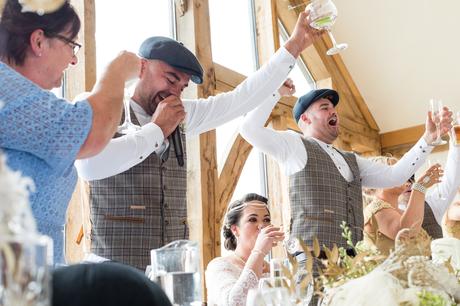 Raising glasses for a toast at Sandburn Hall Wedding. 