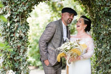 Peaky Blinders styled couple laughing during couples portraits at York Wedding. 