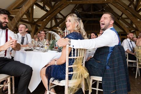Guests laughing during wedding speeches at York wedding. 