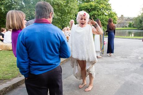 Silly bride shows off dress with a dirty hem at fun wedding in Yorkshire