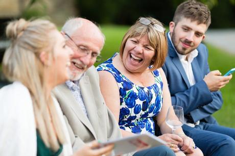 Guests laughing at wedding at East Riddlesden Hall