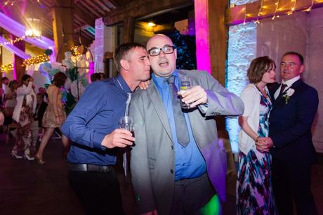 Guests making silly faces at wedding party