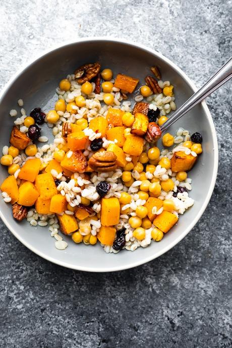 overhead view of Chickpea, Barley and Butternut Squash Jar Salads shaken out into a bowl