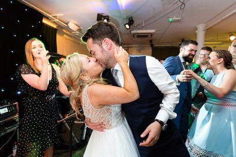 Bride & groom kiss on the dance floor at London wedding. 