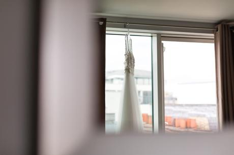 Reflection of wedding dress in the window at London, Asylum wedding. 