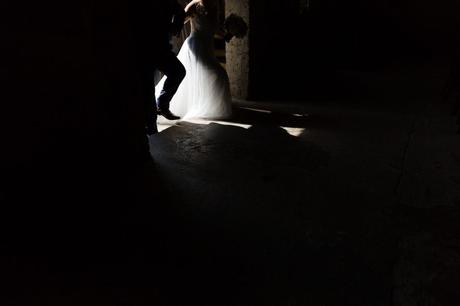 Painting with light dark and light entrance of bride walking into the Asylum wedding venue. 