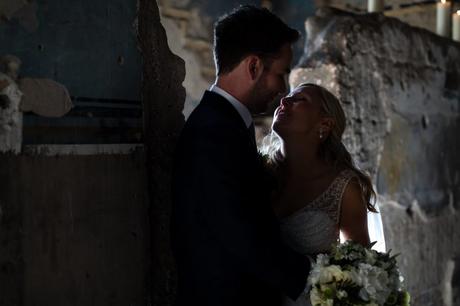 Dark, keylight couple's portrait at The Asylum wedding venue. 