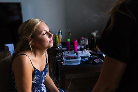 Bride being misted by setting spray at Asylum wedding. 