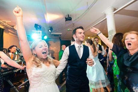 Bride dances with abandon at London wedding. 