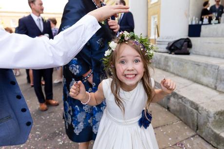 Flower girl covered in confetti at Asylum wedding. 