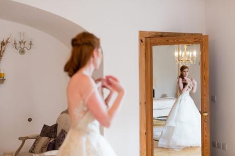 Reflection of redheaded bride in mirror at Achnagairn Estate wedding